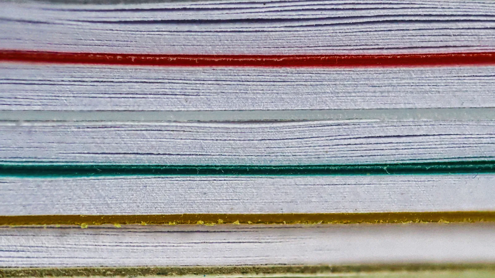 Close-up of stacked paper documents and association records